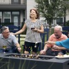 a group of people laughing around a fire