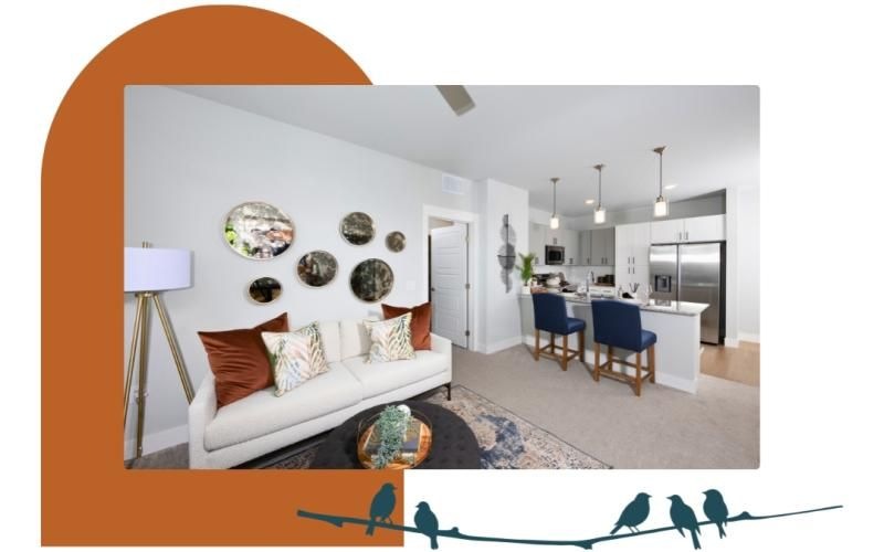 Settle into comfort at Mera Henderson a living room with a couch and dining table