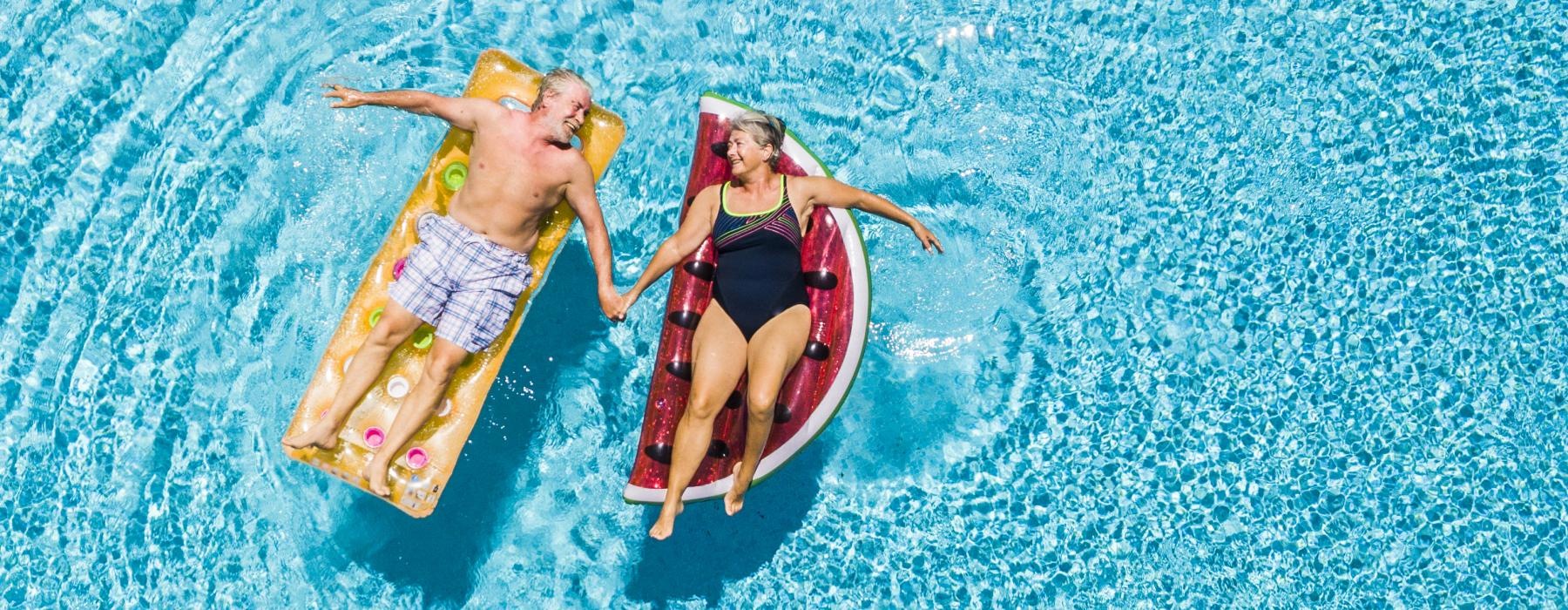 Find your perfect fit at Mera Henderson a couple of people in swimsuits in the water