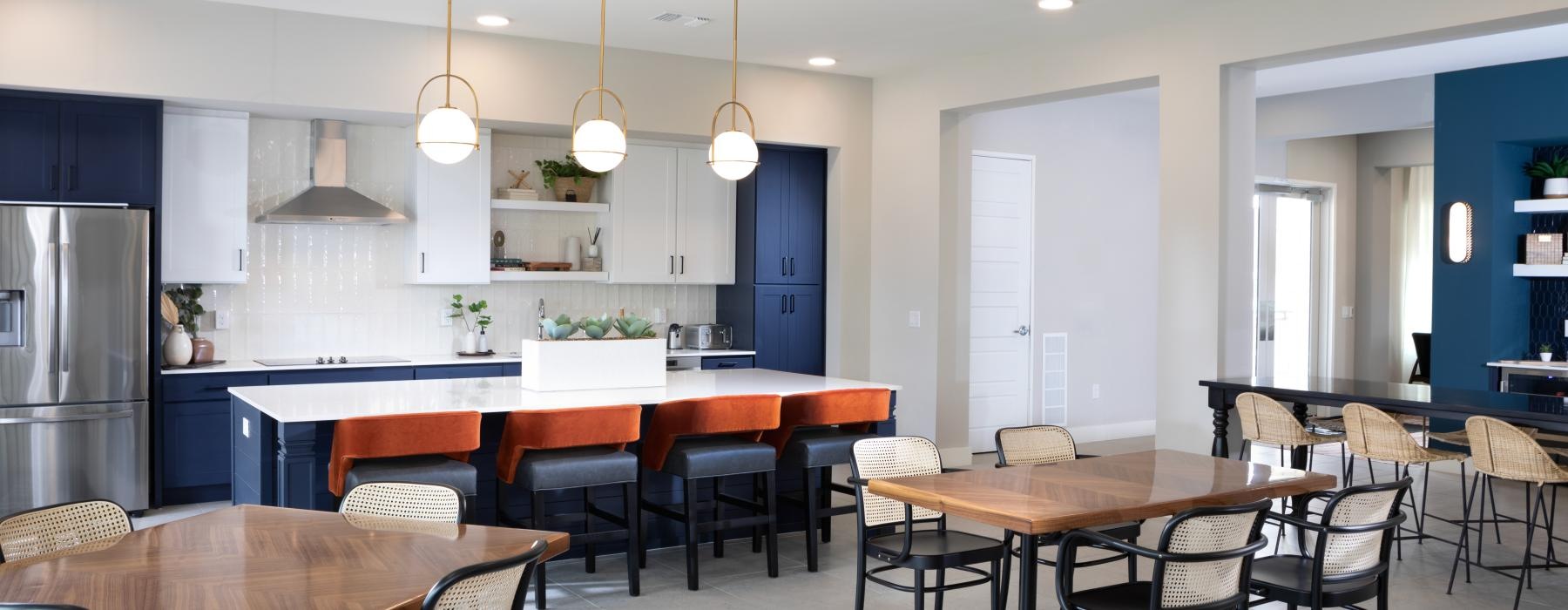 a kitchen with tables and chairs