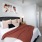 a bedroom with a bed and lamps