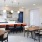 a kitchen with tables and chairs